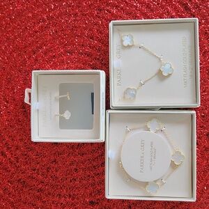 NWT. Elegant Parker and Grey  14 kt flash gold plated unique set